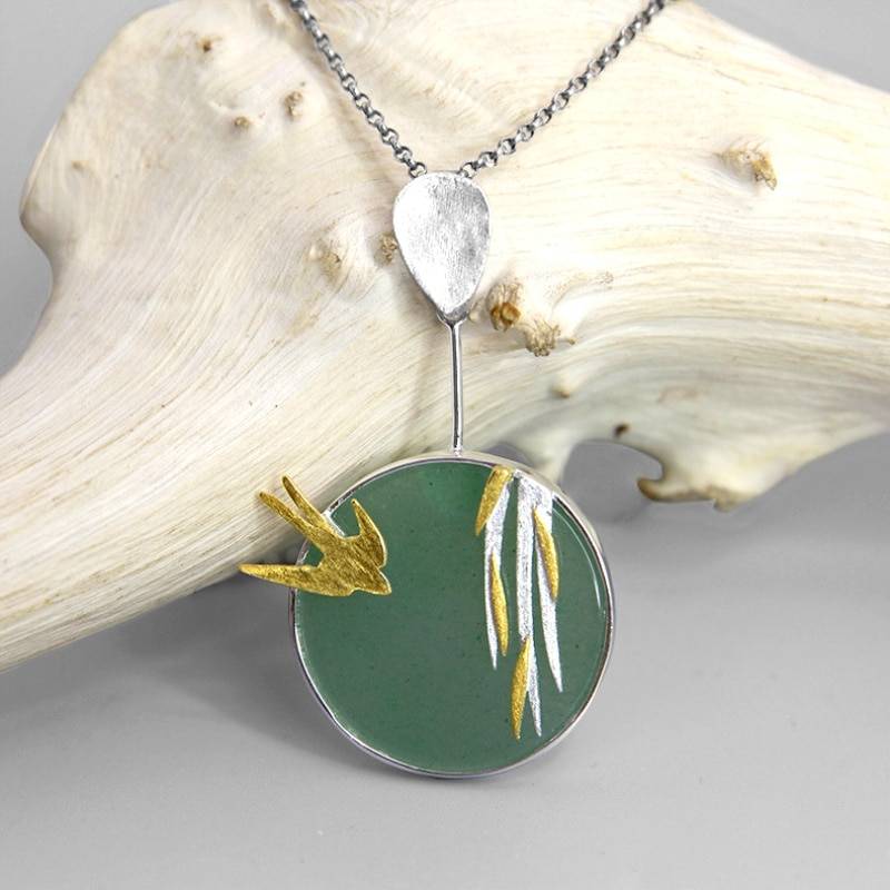 Soaring Swallow Pendant Necklace on display
